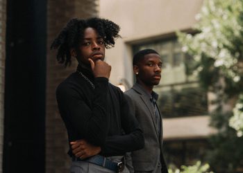 Why do some holidaymakers like to dress to impress?